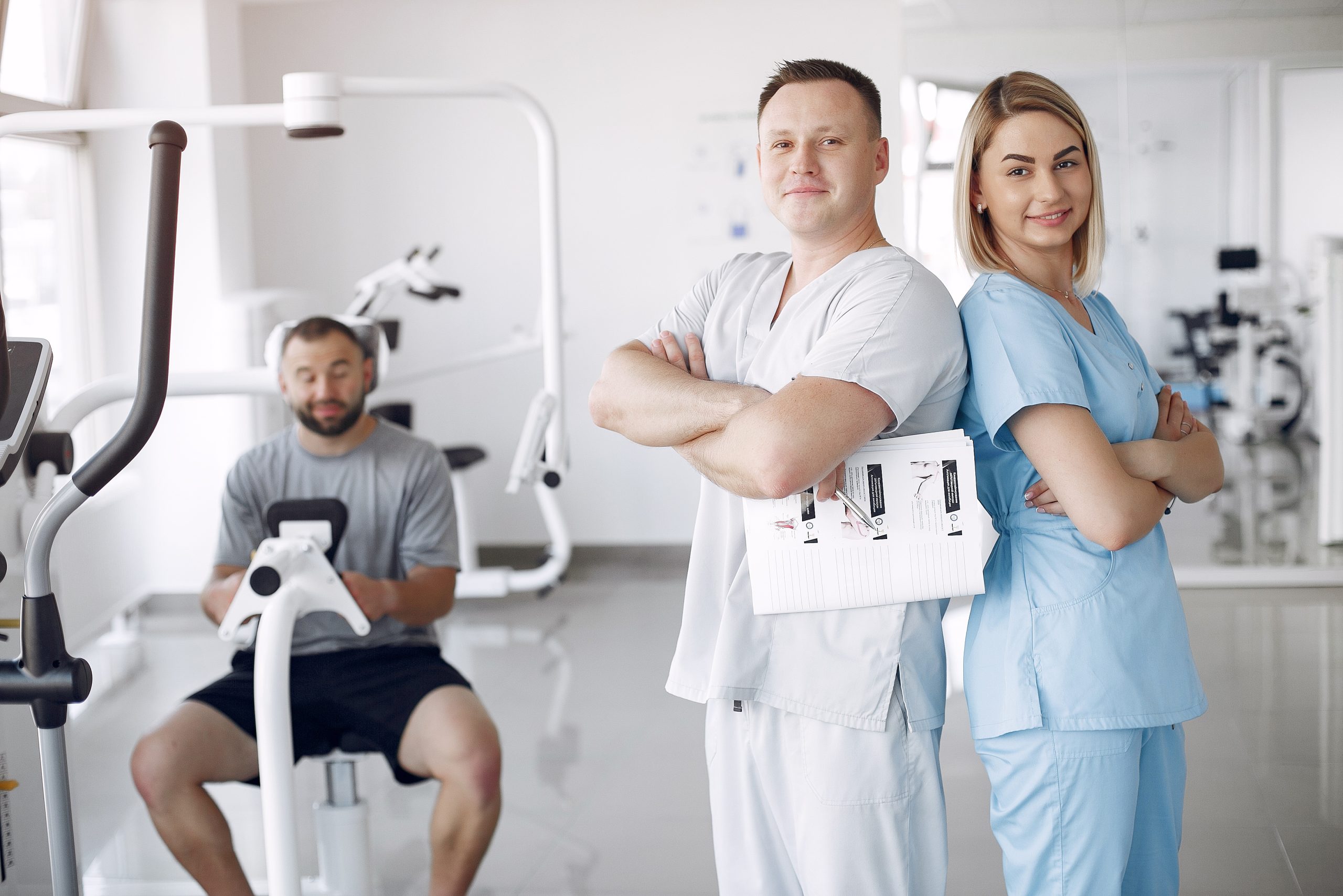 doctor with patient physiotherapy clinic